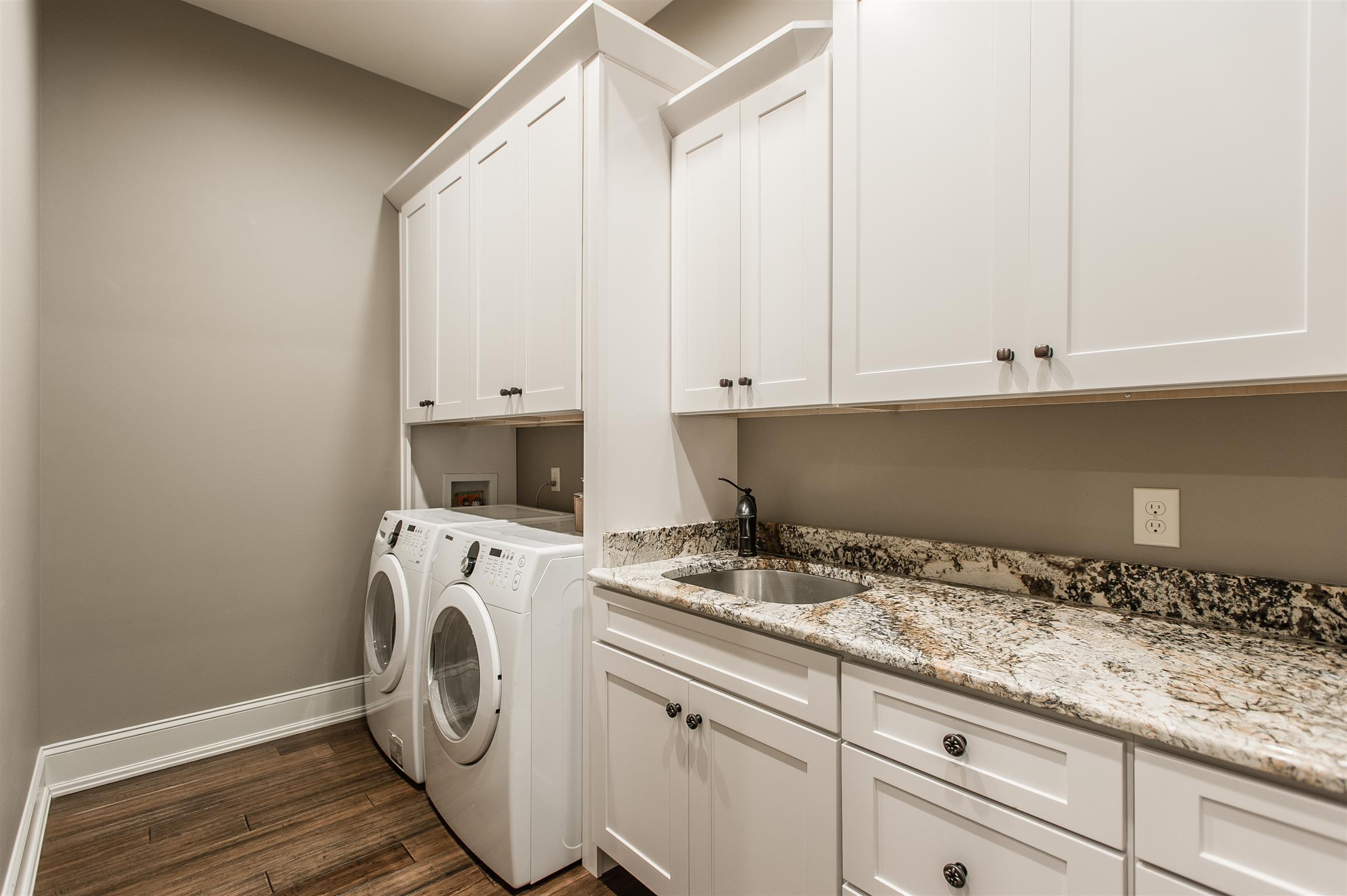 148 Cherokee Road Hendersonville, TN 37075 - Photo 19 of 30 a utility room with granite countertop white cabinets and washer dryer