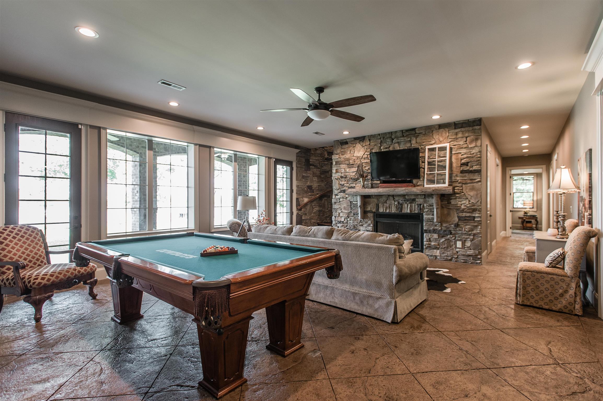 148 Cherokee Road Hendersonville, TN 37075 - Photo 20 of 30 a living room with fireplace furniture and a flat screen tv