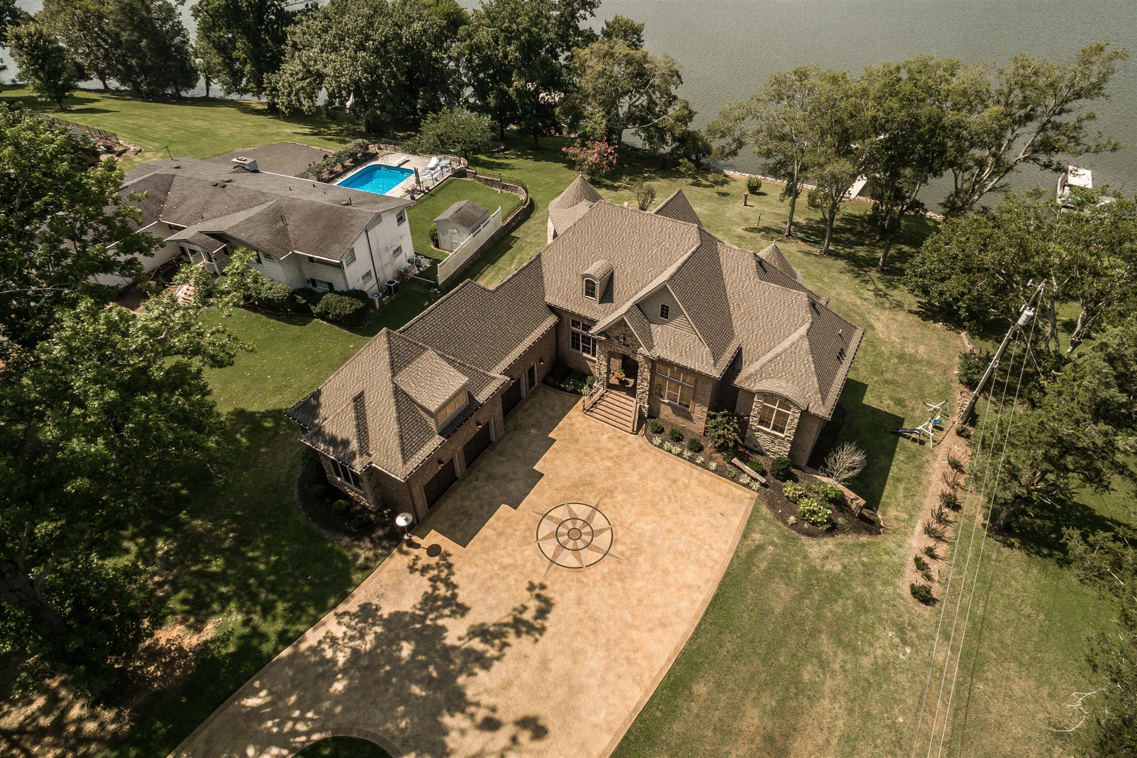 148 Cherokee Road Hendersonville, TN 37075 - Photo 2 of 30 an aerial view of a house with a yard and lake view