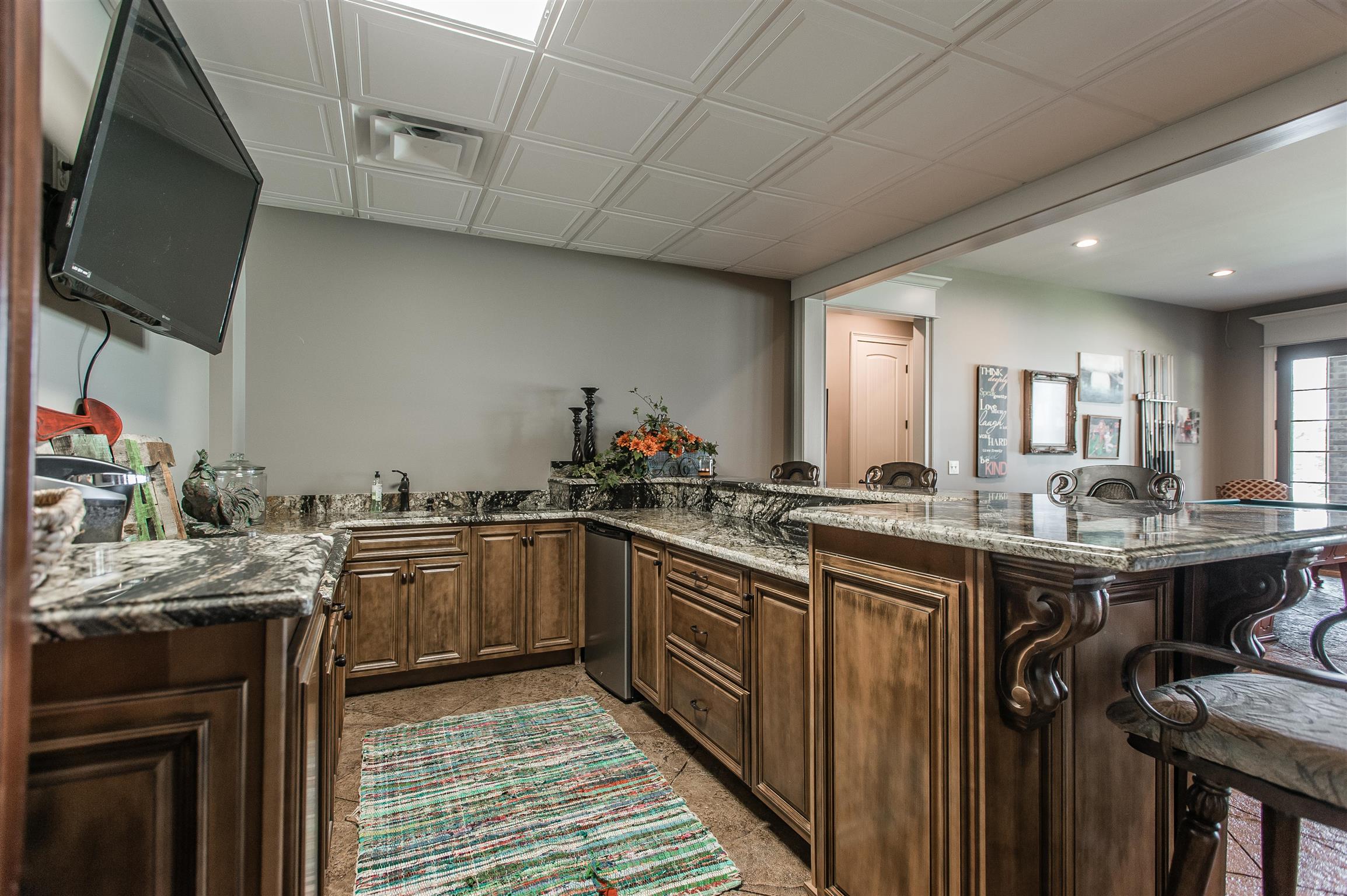 148 Cherokee Road Hendersonville, TN 37075 - Photo 21 of 30 a kitchen with granite countertop a sink stove and cabinets