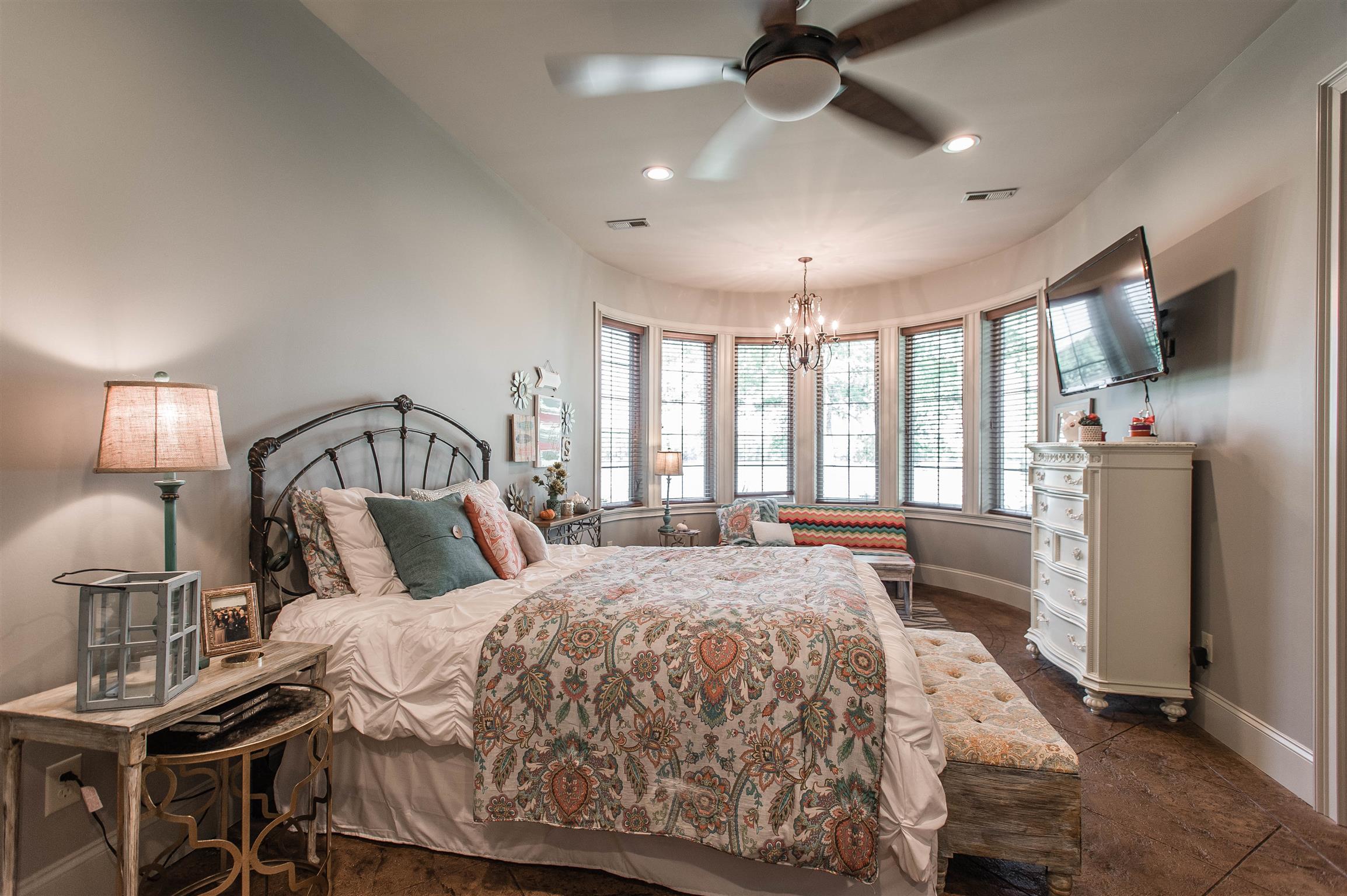 148 Cherokee Road Hendersonville, TN 37075 - Photo 22 of 30 a bedroom with a bed a flat tv screen and a dresser