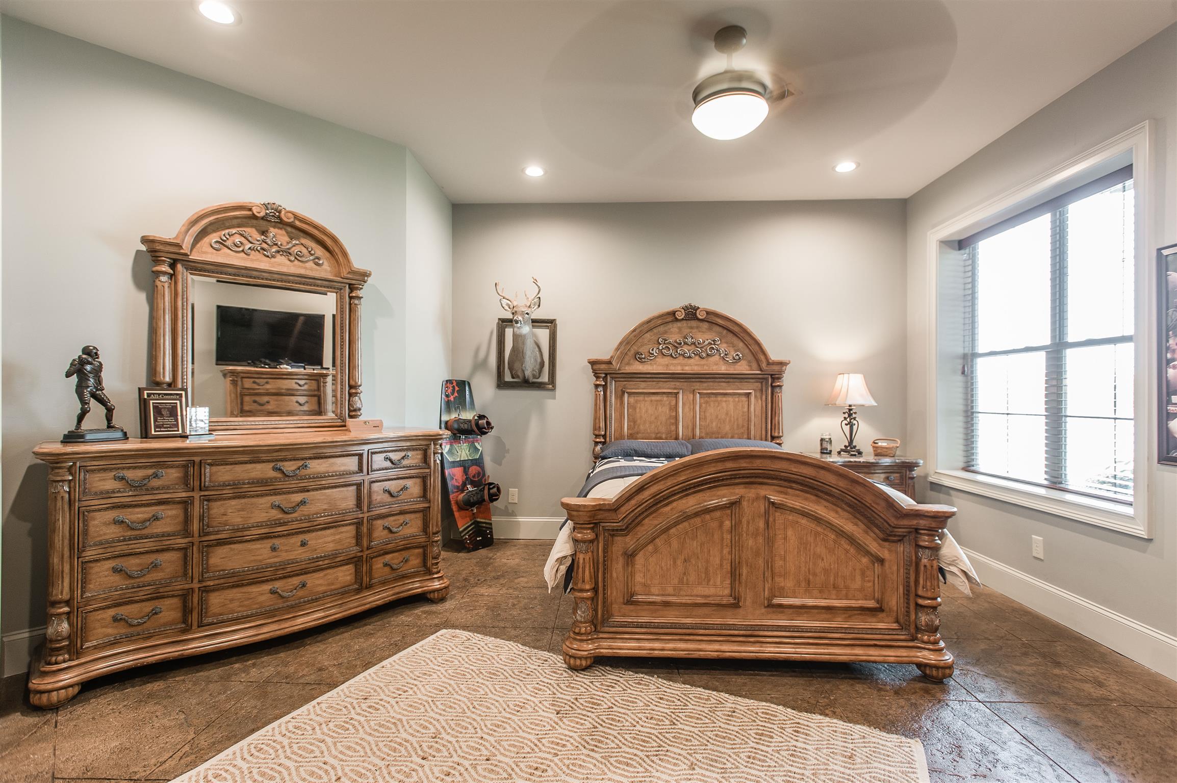 148 Cherokee Road Hendersonville, TN 37075 - Photo 23 of 30 a bedroom with a bed and a large window