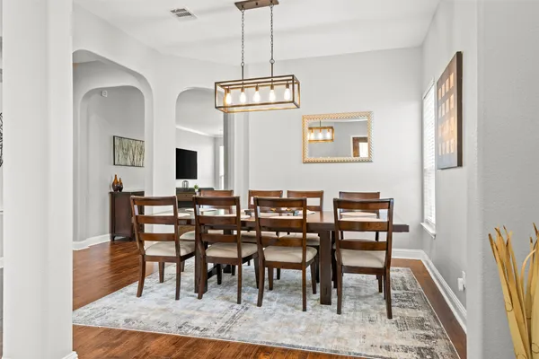 a view of a dining room with furniture
