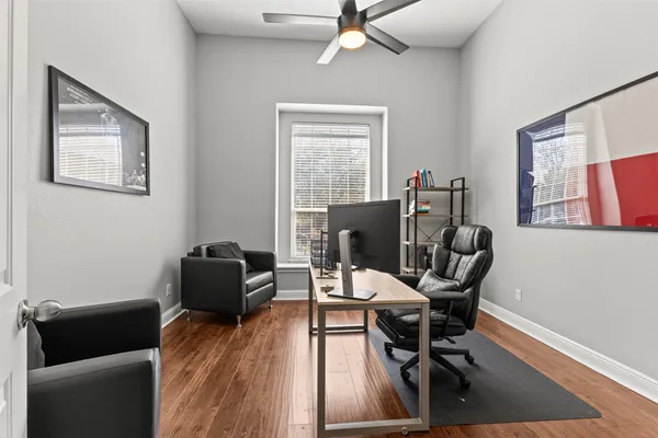 a work room with furniture and windows