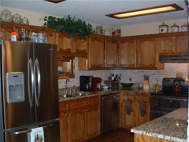 2212 Red Mile Road Murfreesboro, TN 37127 - Photo 5 of 20 You'll love this kitchen with granite countertops, the backsplash, SS appliances and kitchen island.