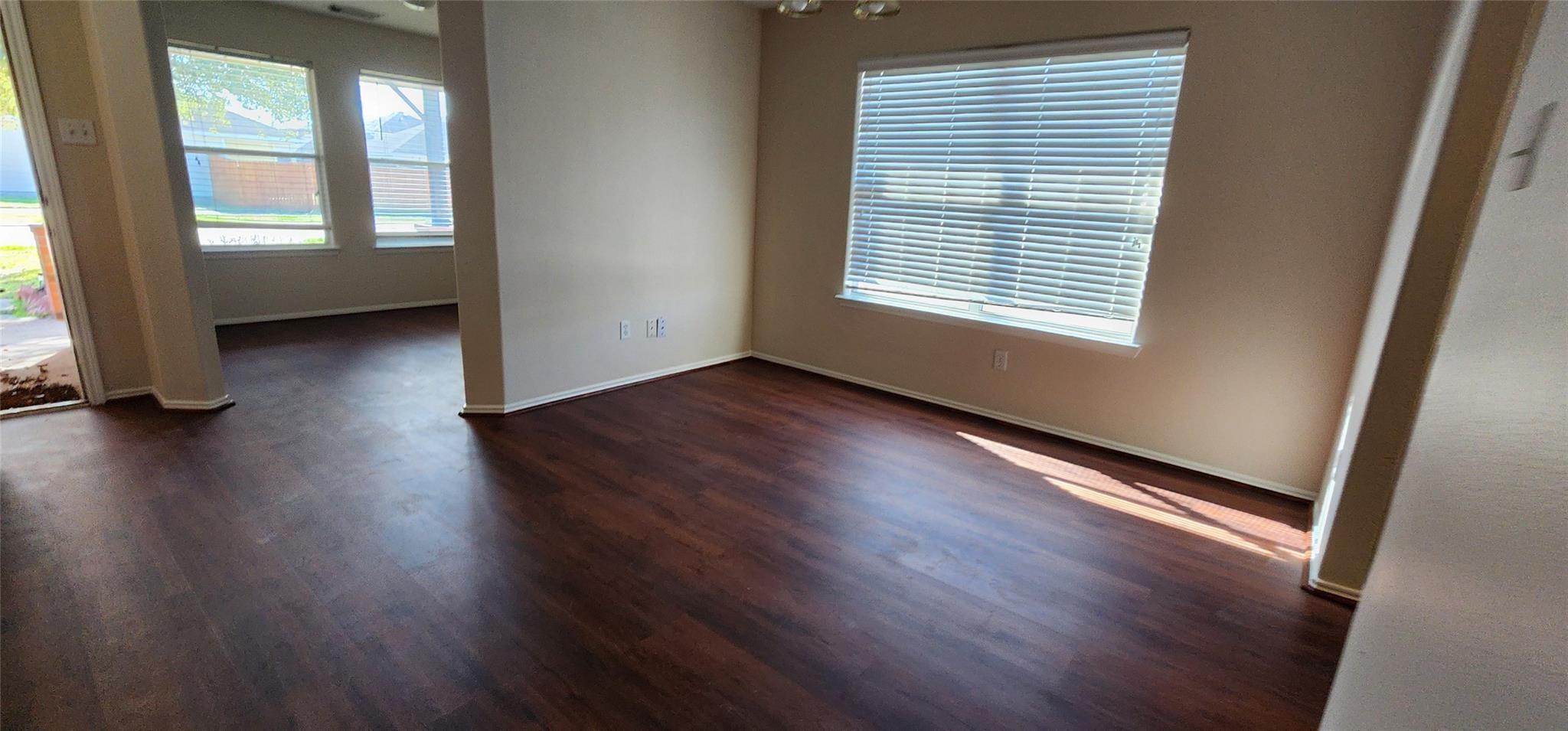 315 Sunset Colony Drive Rosharon, TX 77583 - Photo 4 of 20 an empty room with wooden floor and windows