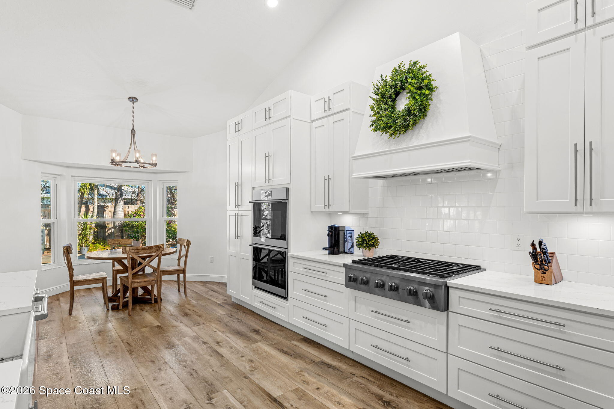 482 Veracruz Boulevard Indialantic, FL 32903 - Photo 17 of 45 a kitchen with a table and chairs in it