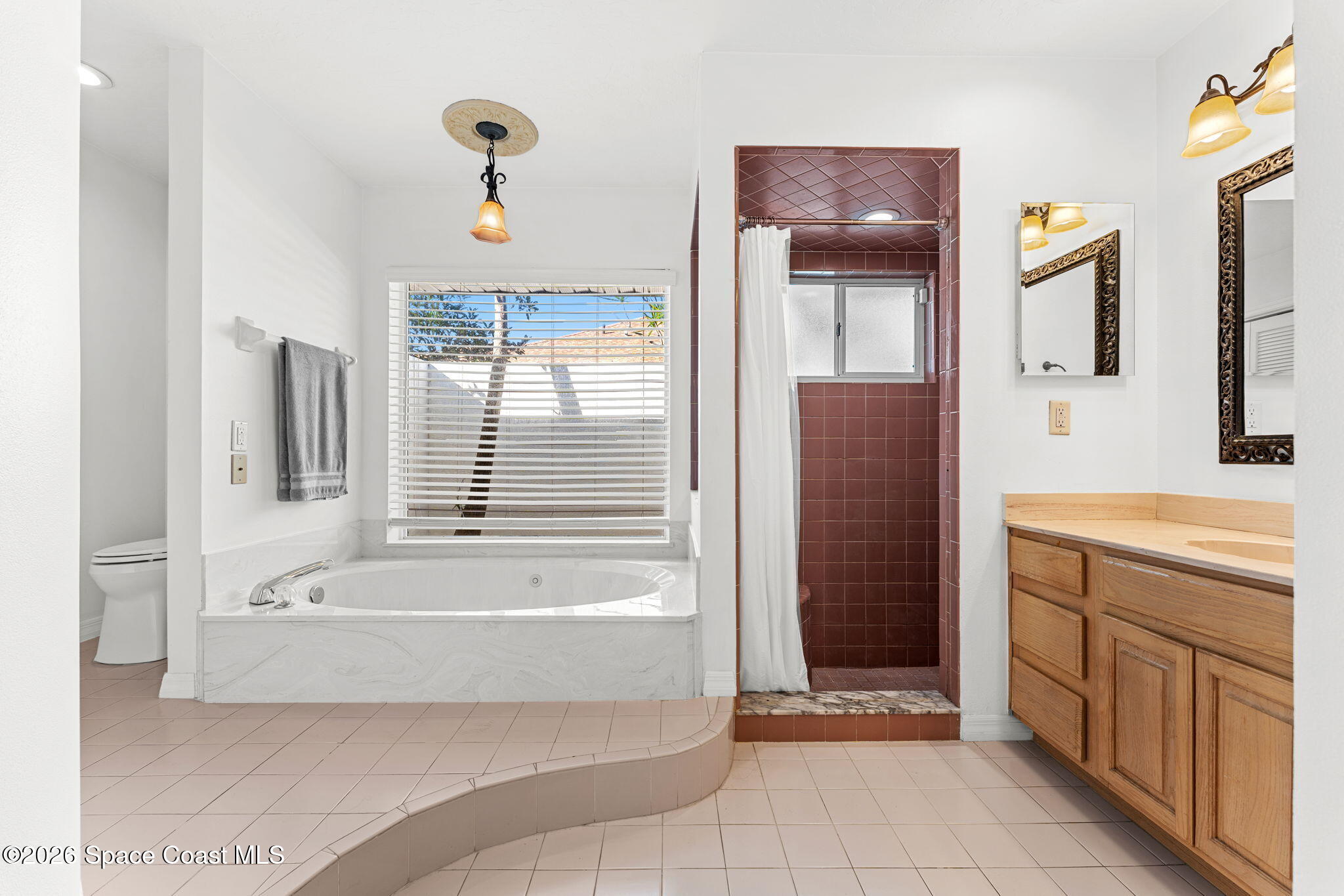 482 Veracruz Boulevard Indialantic, FL 32903 - Photo 20 of 45 a bathroom with a tub a sink and a shower