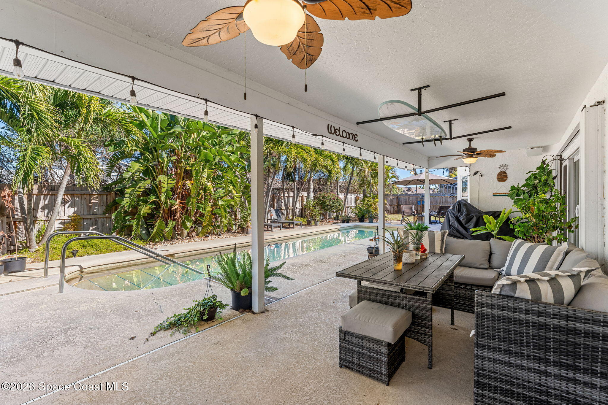 482 Veracruz Boulevard Indialantic, FL 32903 - Photo 2 of 45 a building outdoor space with patio furniture and potted plants