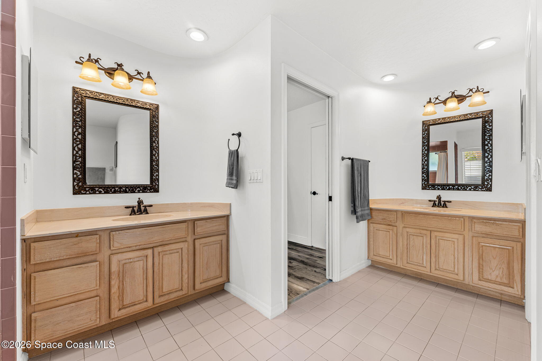 482 Veracruz Boulevard Indialantic, FL 32903 - Photo 22 of 45 a spacious bathroom with a double vanity sink mirror and