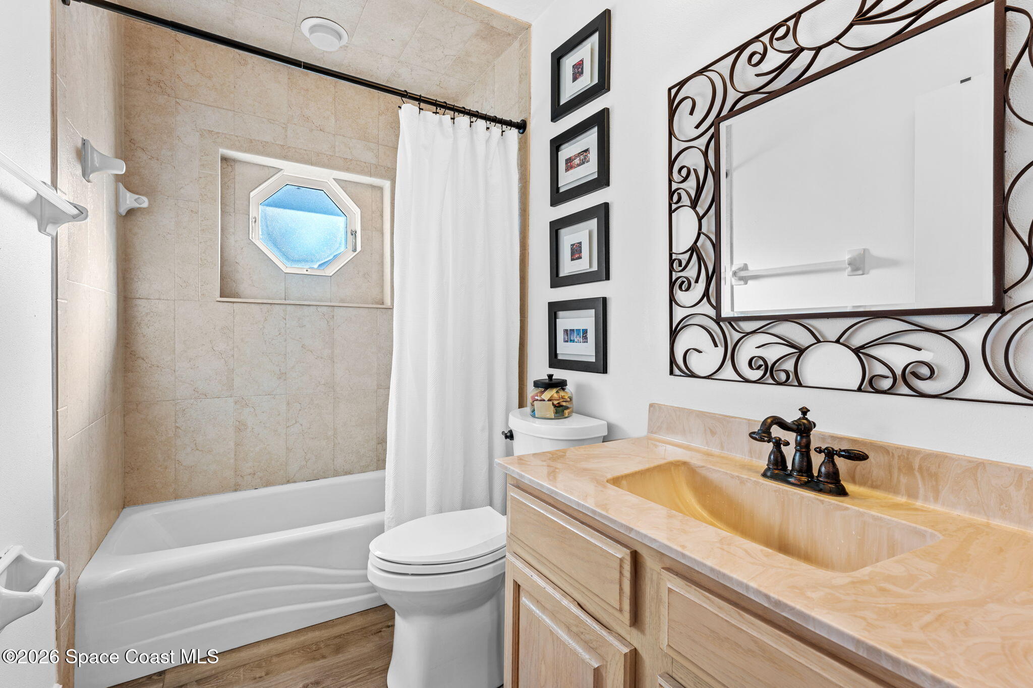 482 Veracruz Boulevard Indialantic, FL 32903 - Photo 24 of 45 a bathroom with a sink a toilet and shower