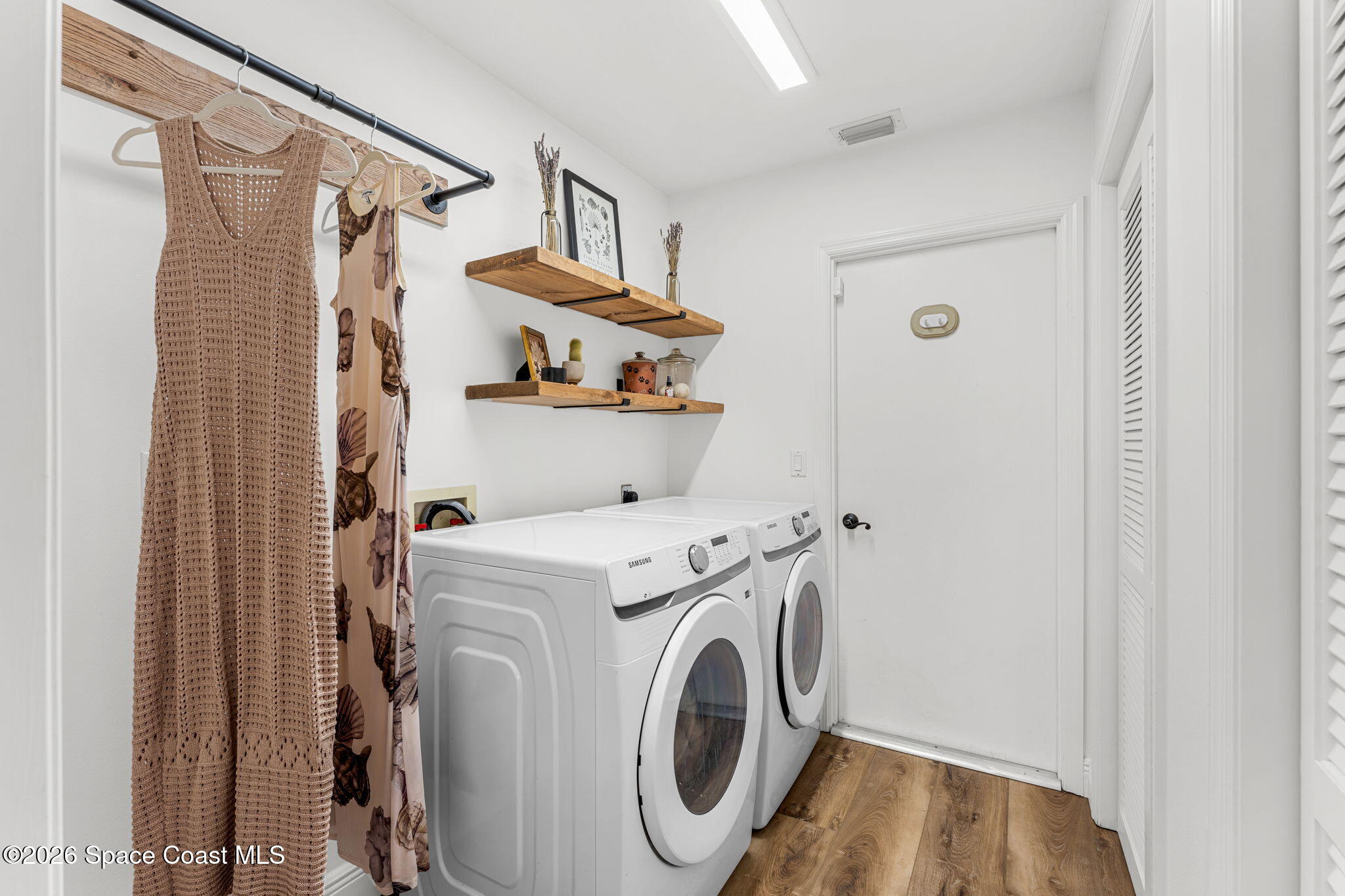 482 Veracruz Boulevard Indialantic, FL 32903 - Photo 26 of 45 a utility room with dryer and washer