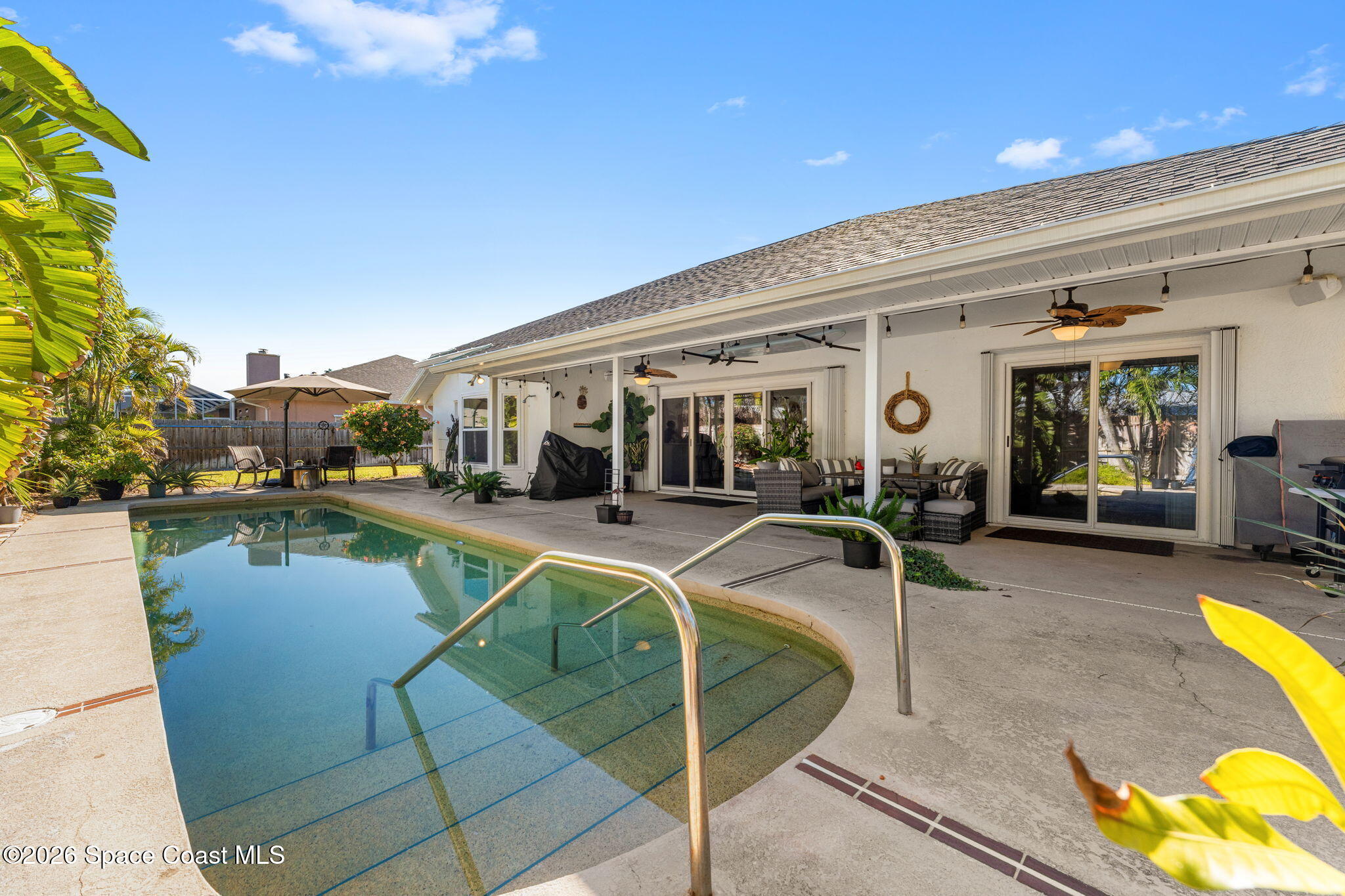 482 Veracruz Boulevard Indialantic, FL 32903 - Photo 29 of 45 a view of a swimming pool with outdoor seating and plants
