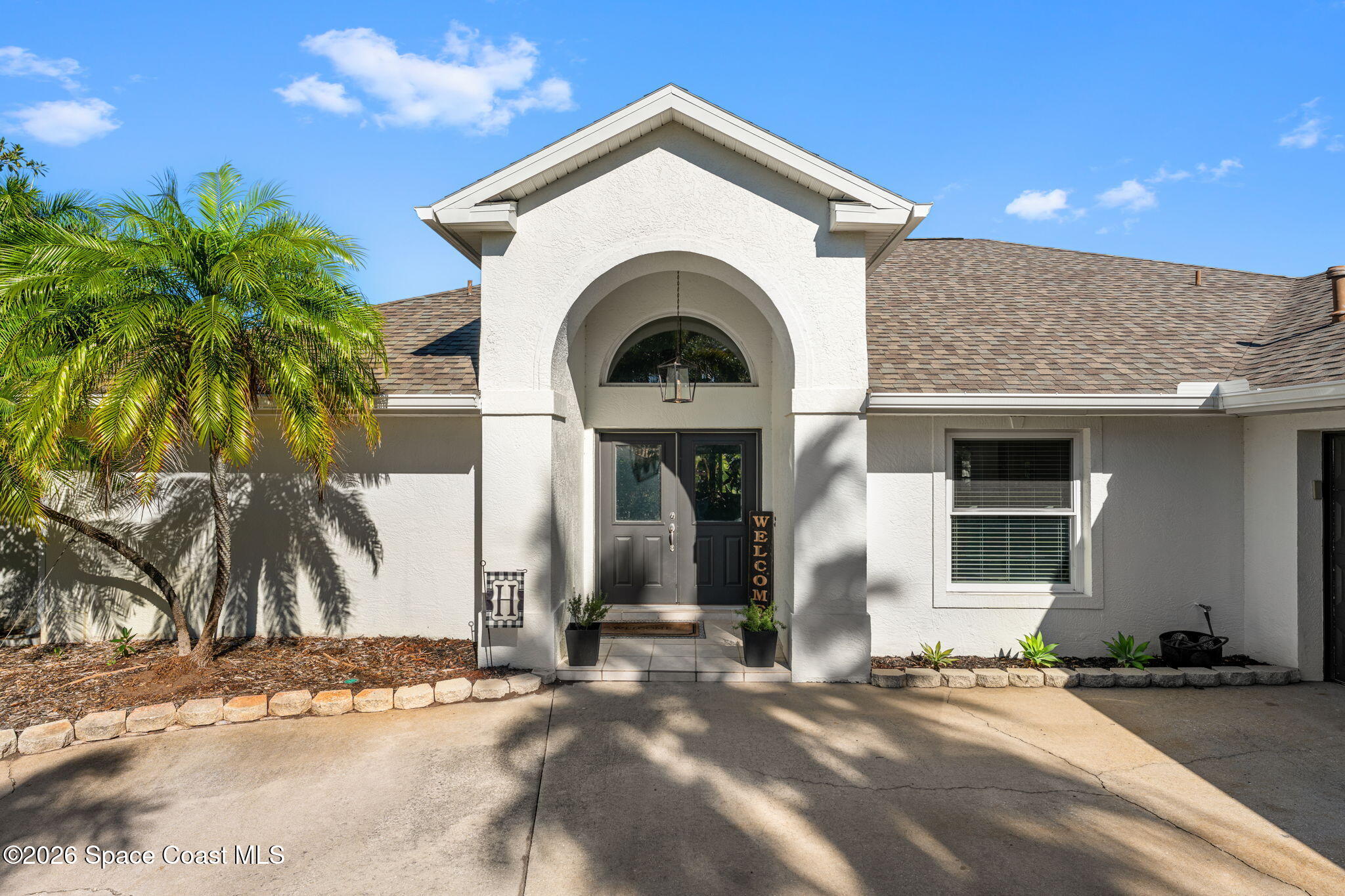 482 Veracruz Boulevard Indialantic, FL 32903 - Photo 37 of 45 a view of a house with a yard