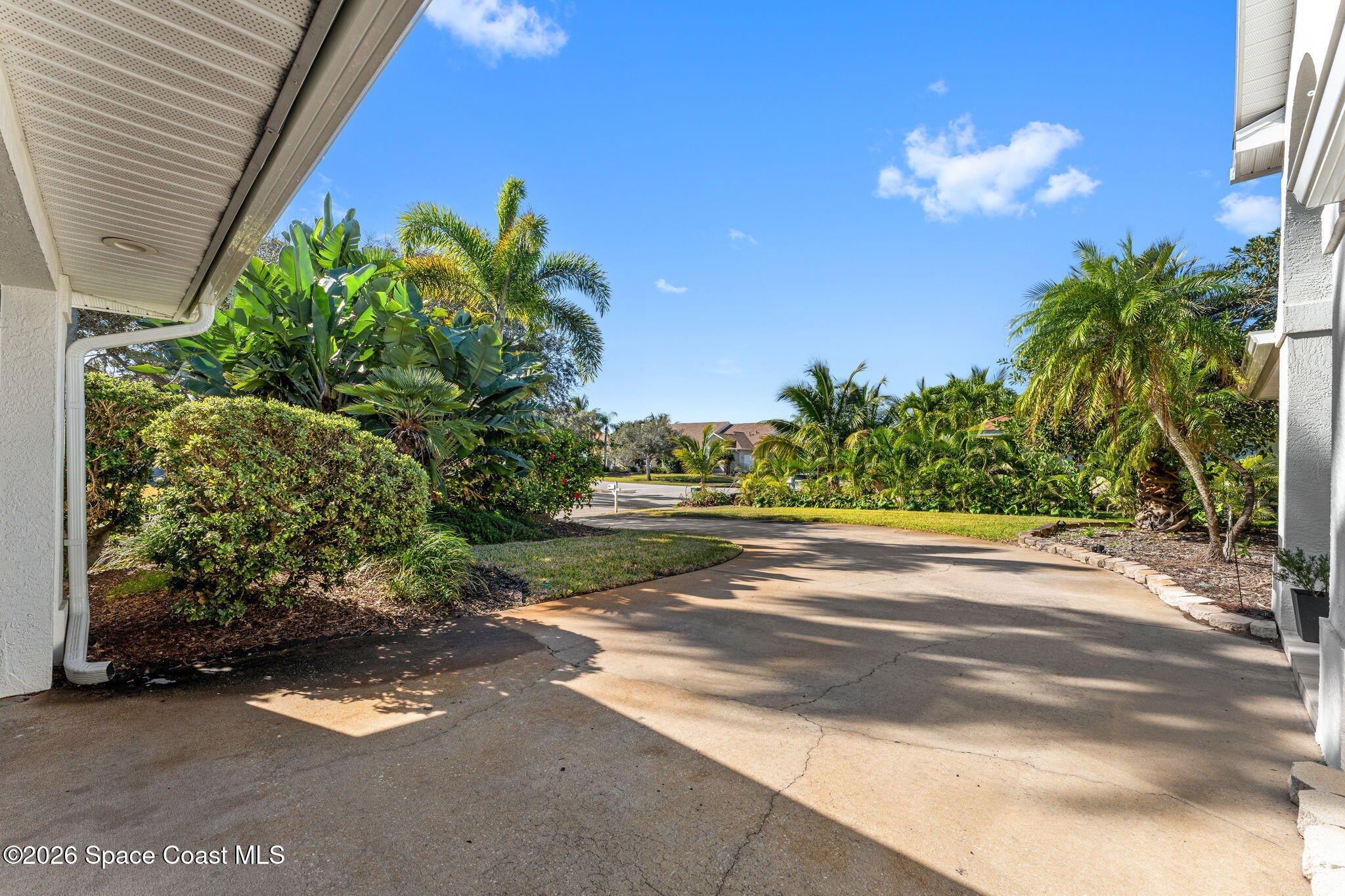 482 Veracruz Boulevard Indialantic, FL 32903 - Photo 38 of 45 a backyard of a house with lots of green space
