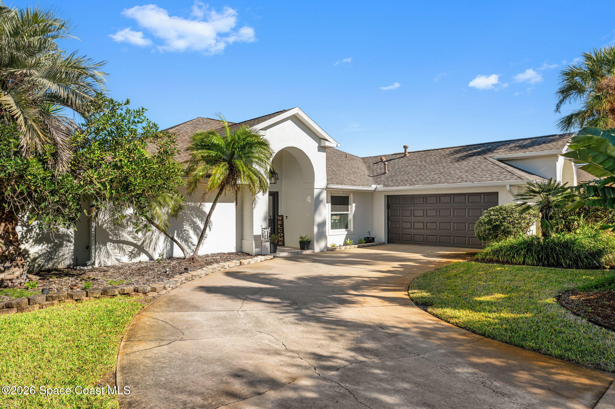 482 Veracruz Boulevard Indialantic, FL 32903 - Photo 39 of 45 a view of a house with a yard and plants