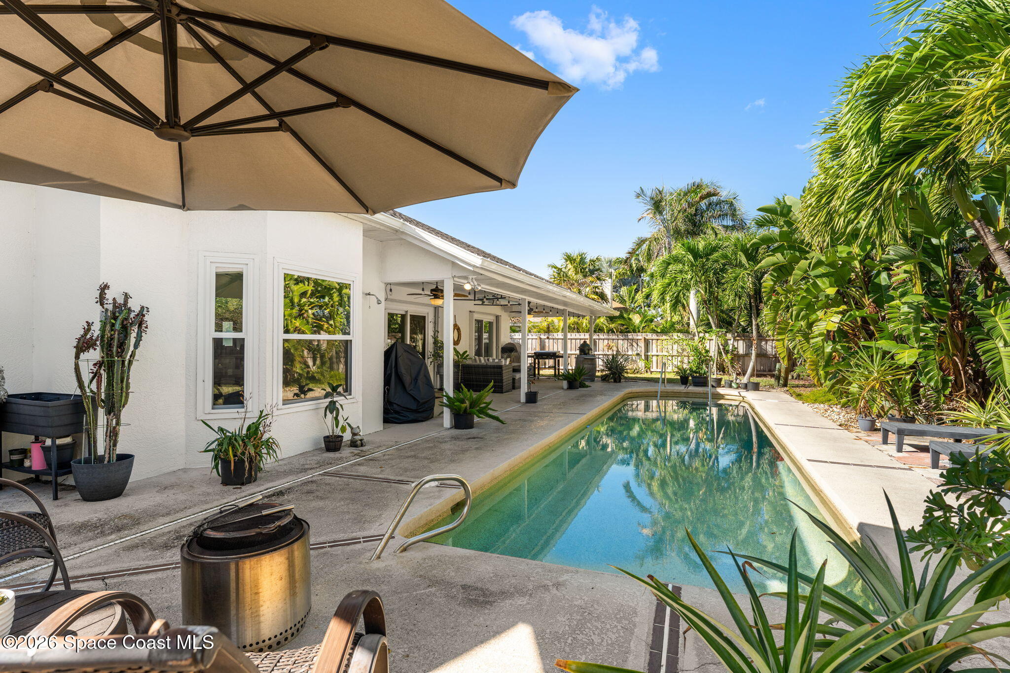 482 Veracruz Boulevard Indialantic, FL 32903 - Photo 4 of 45 a view of a swimming pool with a patio