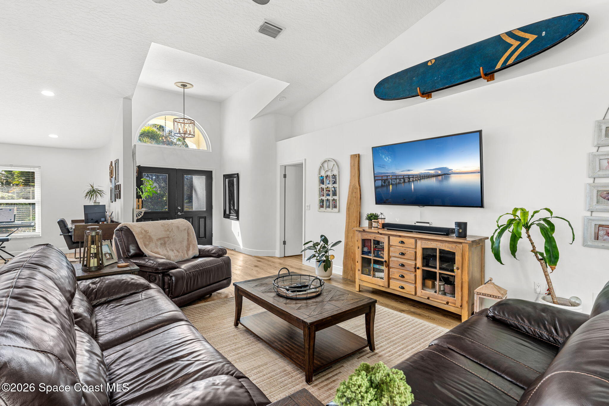 482 Veracruz Boulevard Indialantic, FL 32903 - Photo 10 of 45 a living room with furniture and a flat screen tv