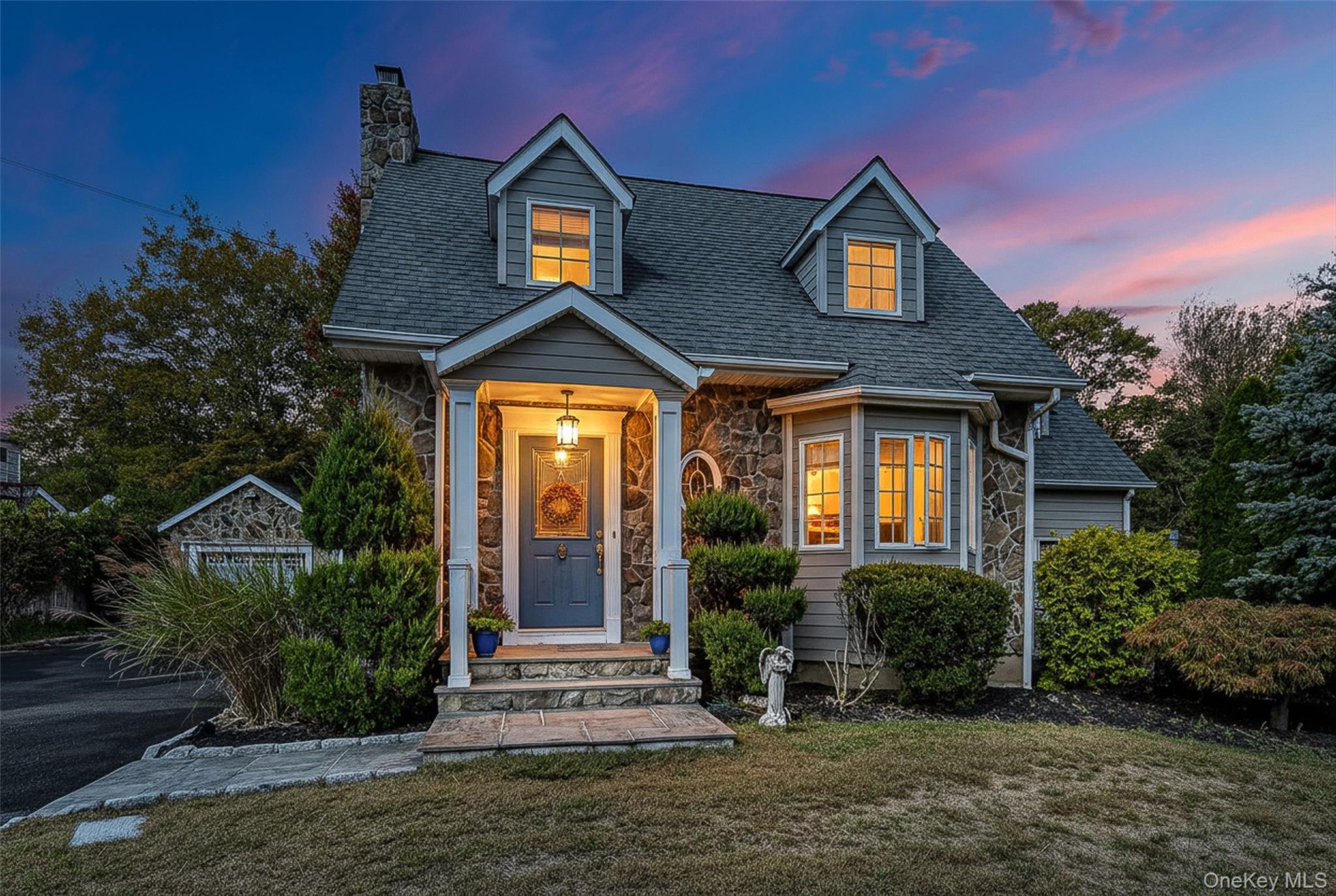 a front view of a house with a yard
