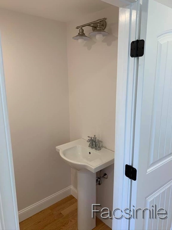 40 Lafayette Road, Unit 2 Salisbury, MA 01952 - Photo 30 of 31 a bathroom with a sink and mirror