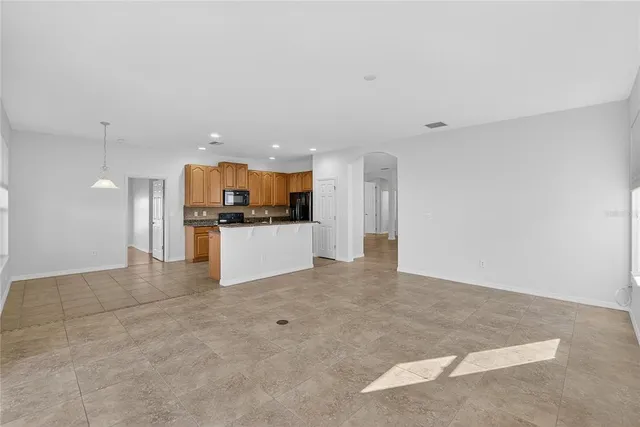 a view of a swimming pool and outdoor seating