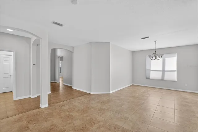 a view of a park with large trees