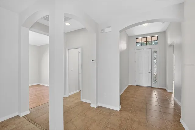 a kitchen with stainless steel appliances granite countertop a stove and a refrigerator