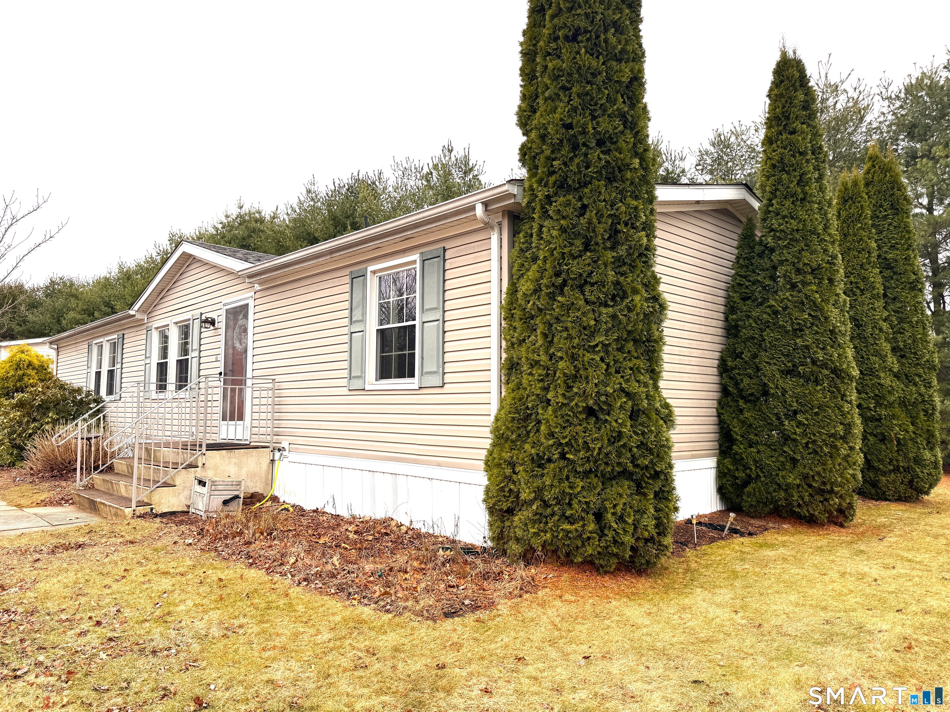 a view of a house with a yard