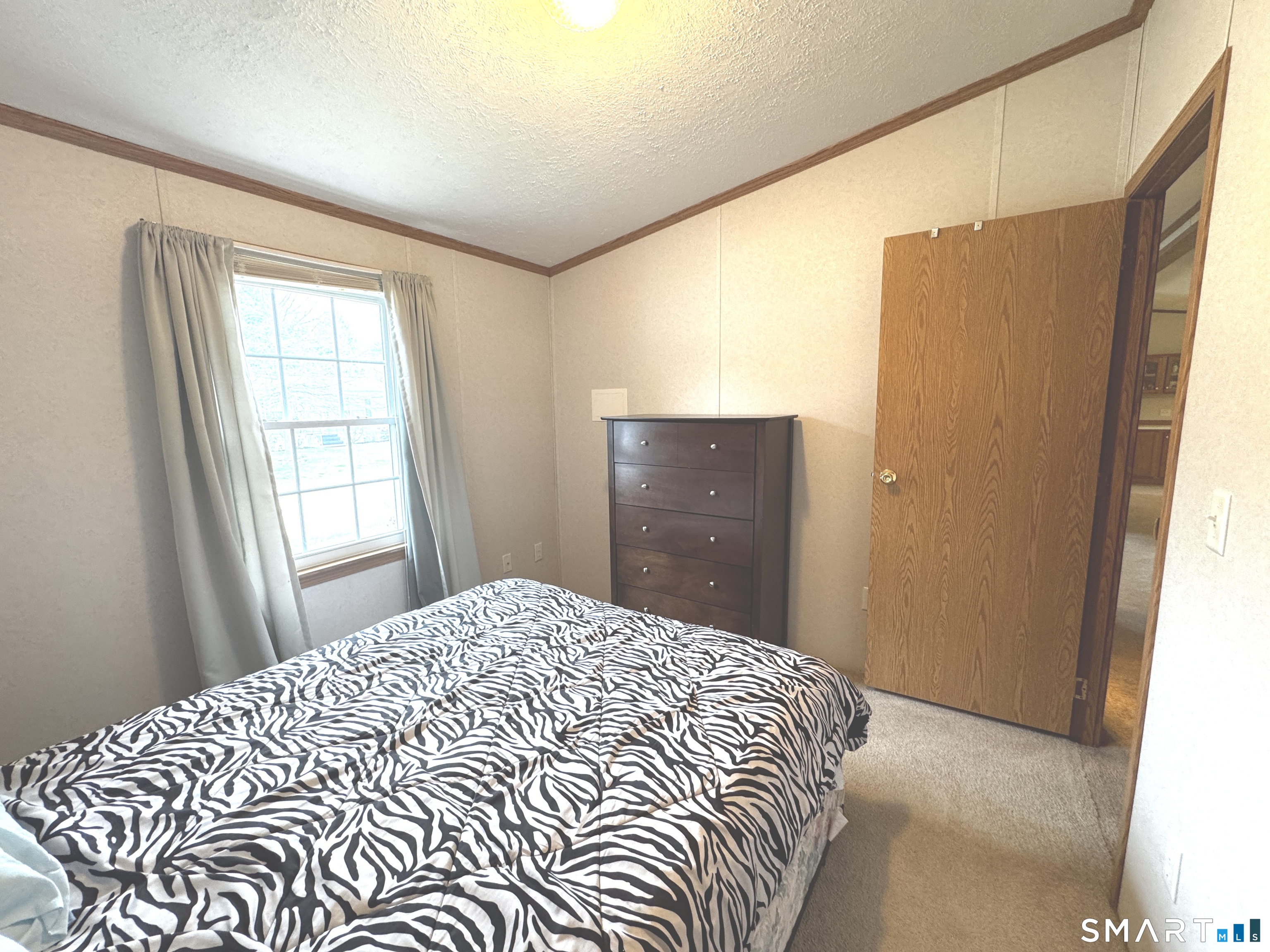 11 Circle Drive Windham, CT 06256 - Photo 13 of 18 a bedroom with a bed and a window