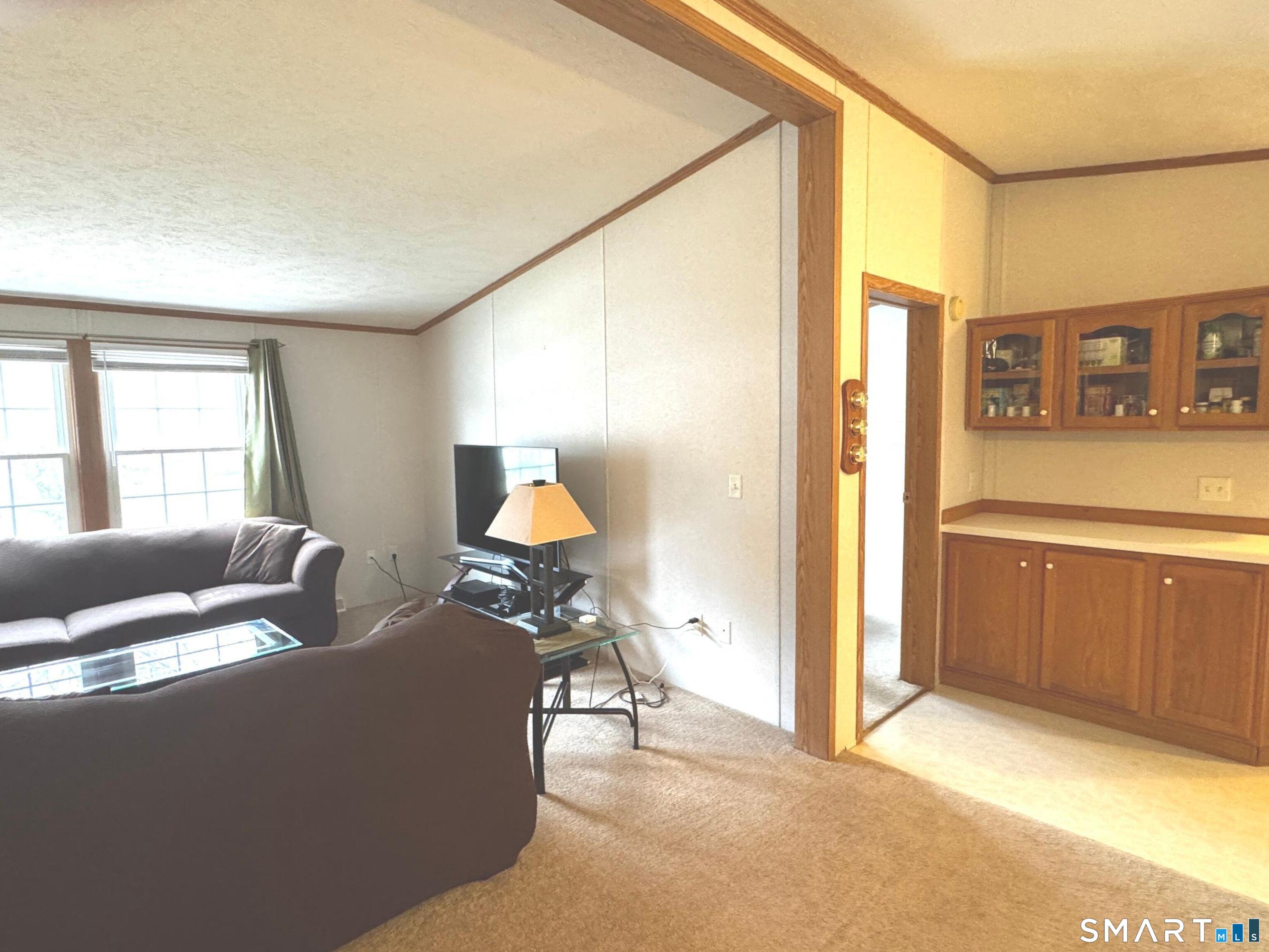 11 Circle Drive Windham, CT 06256 - Photo 4 of 18 a living room with furniture and a window
