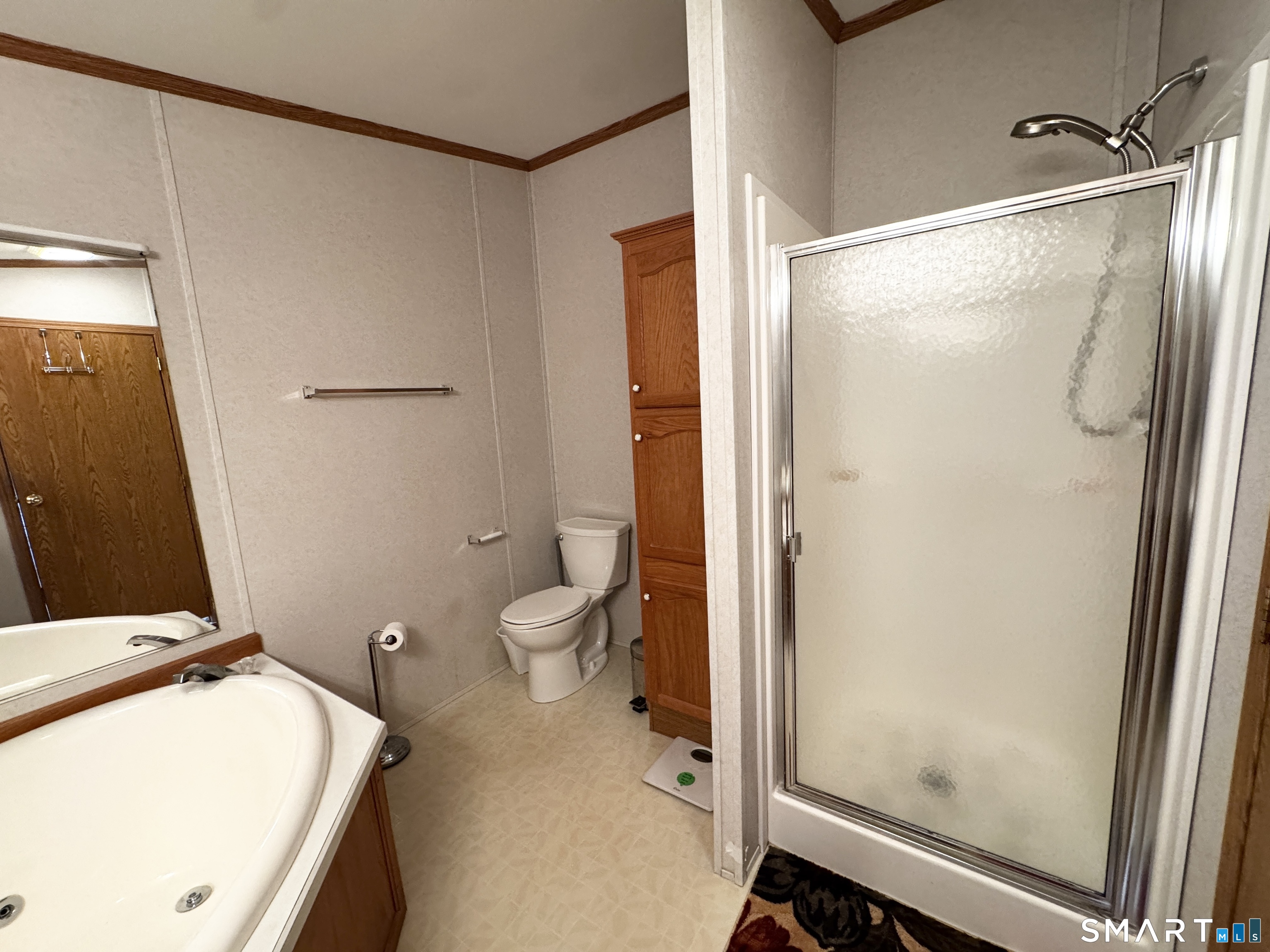 11 Circle Drive Windham, CT 06256 - Photo 8 of 18 a bathroom with a granite countertop sink toilet and shower