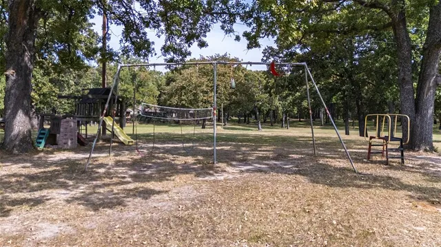 a view of a swimming pool with an outdoor space and seating area