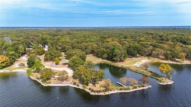 a view of a lake with a yard