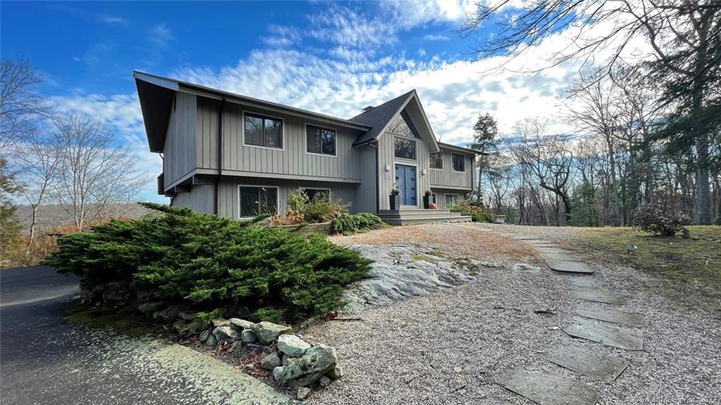 135 Davis Hill Road Weston, CT 06883 - Photo 1 of 1 a front view of a house with a yard