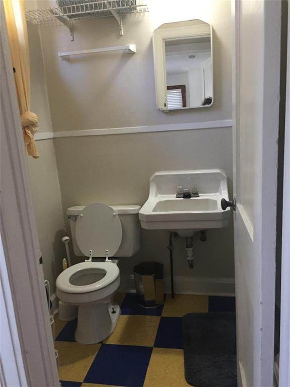 906 West 22nd Street, Unit 4 Austin, TX 78705 - Photo 7 of 7 a bathroom with a sink and a toilet
