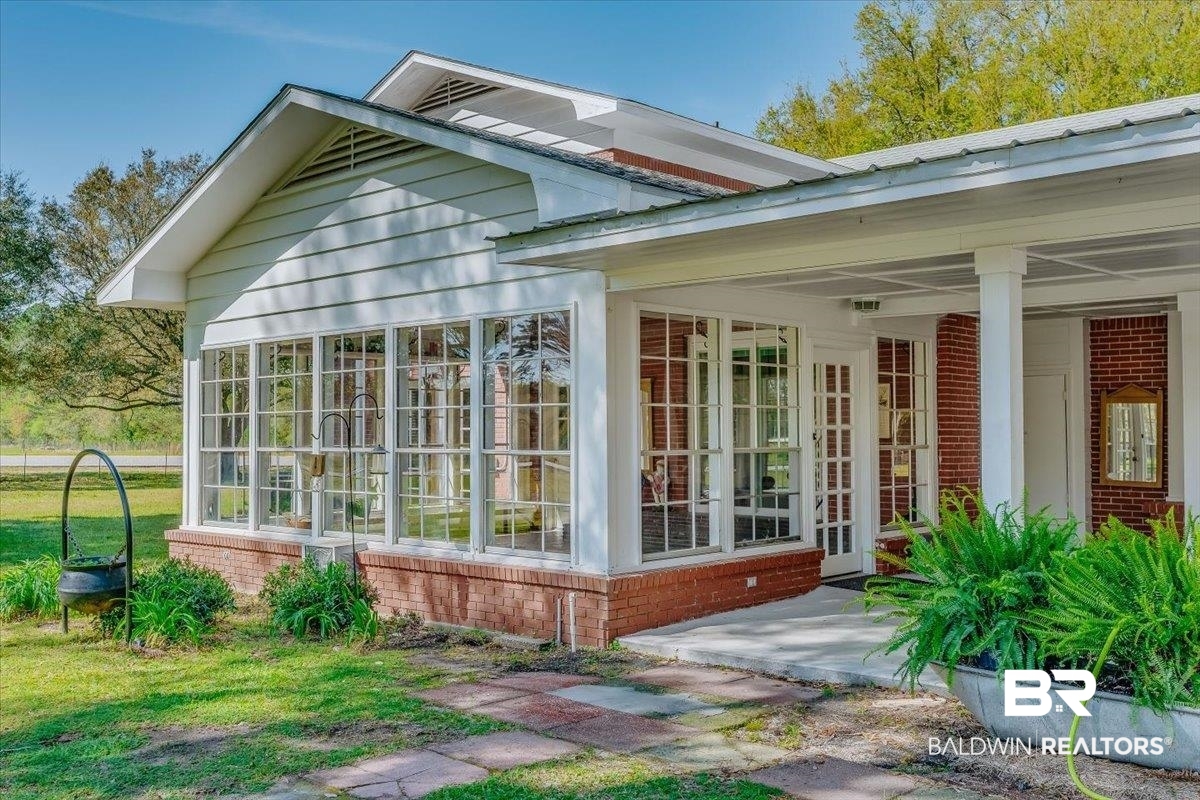 14160 Moffett Road Wilmer, AL 36587 - Photo 48 of 75 Exterior space featuring french doors and brick siding
