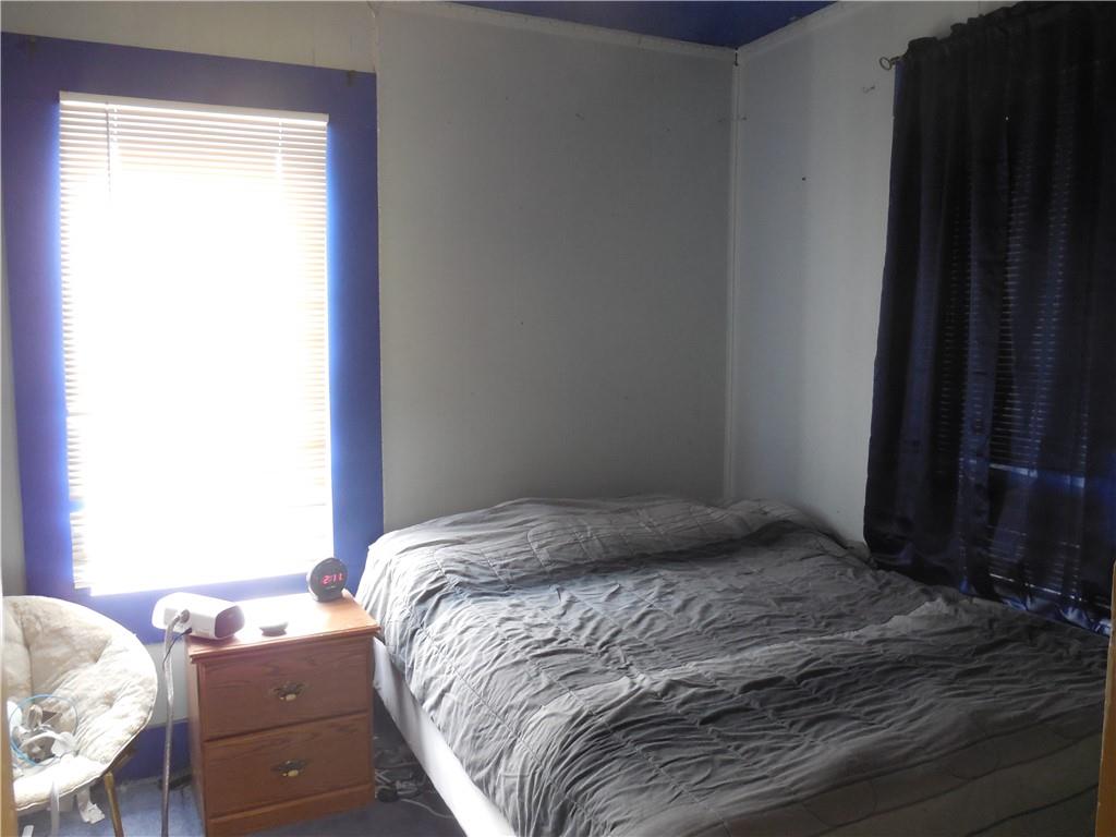 4183 Old Pittsburgh Road Wampum, PA 16157 - Photo 12 of 24 a bedroom with a bed and a window