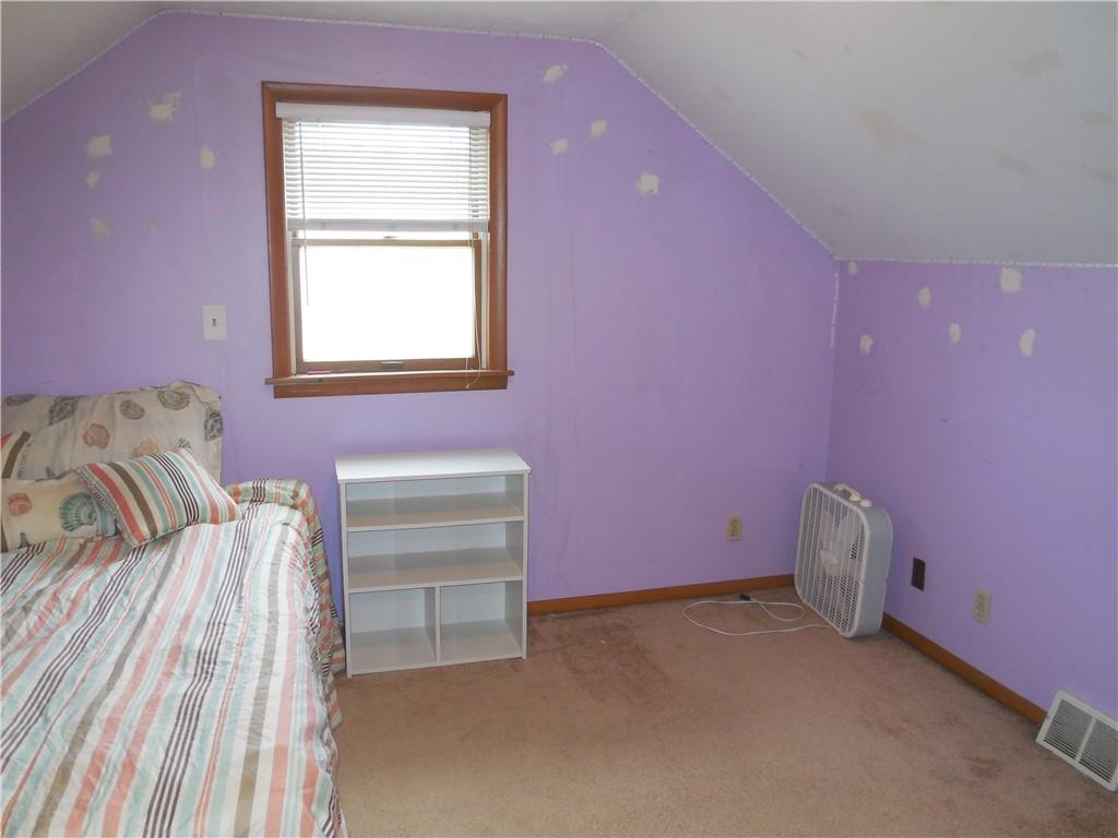 4183 Old Pittsburgh Road Wampum, PA 16157 - Photo 16 of 24 a bedroom with a bed and a window
