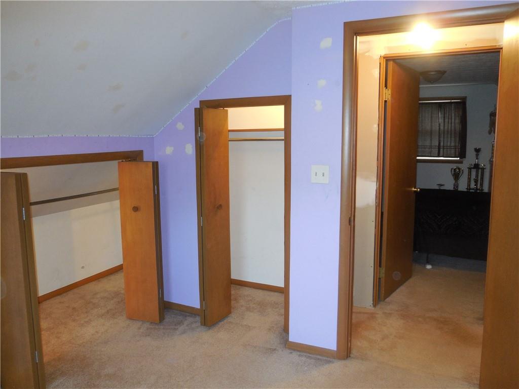 4183 Old Pittsburgh Road Wampum, PA 16157 - Photo 17 of 24 a view of a hallway with closet and a bathroom
