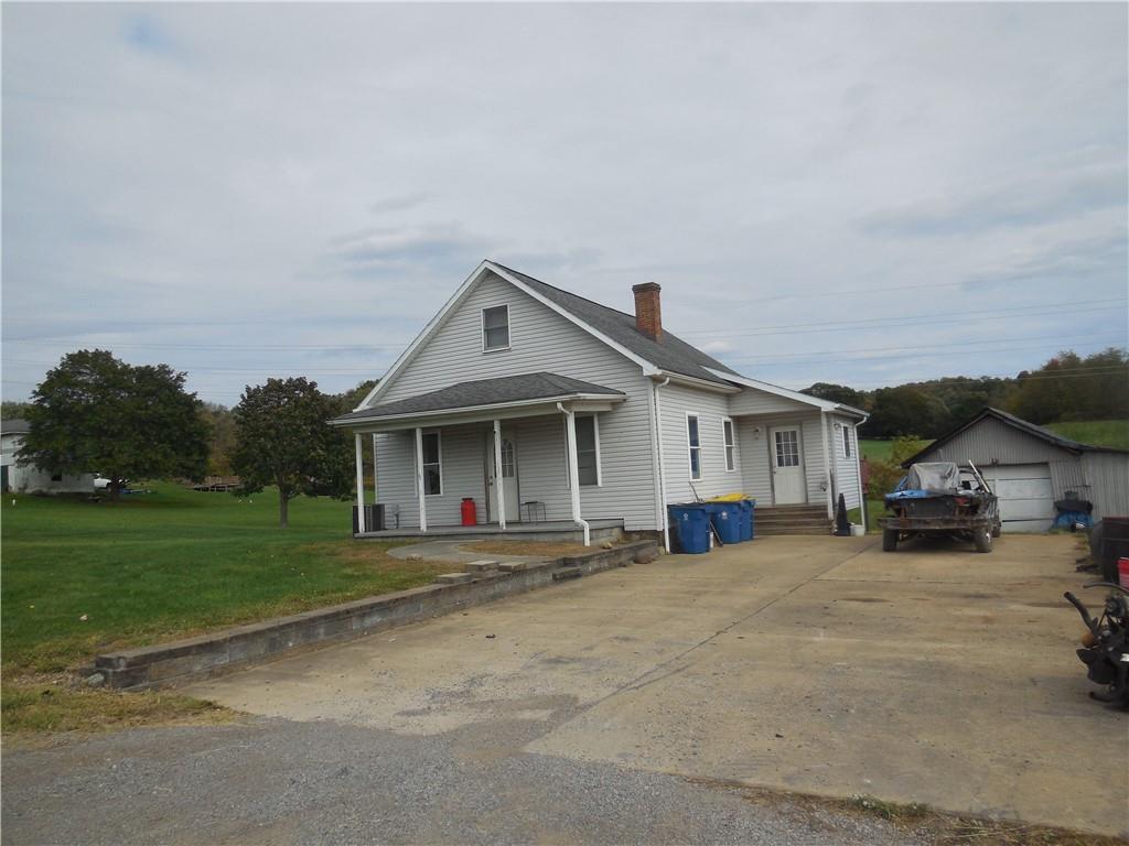 4183 Old Pittsburgh Road Wampum, PA 16157 - Photo 3 of 24 a view of a house with a outdoor space