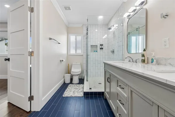 a bathroom with a shower and toilet