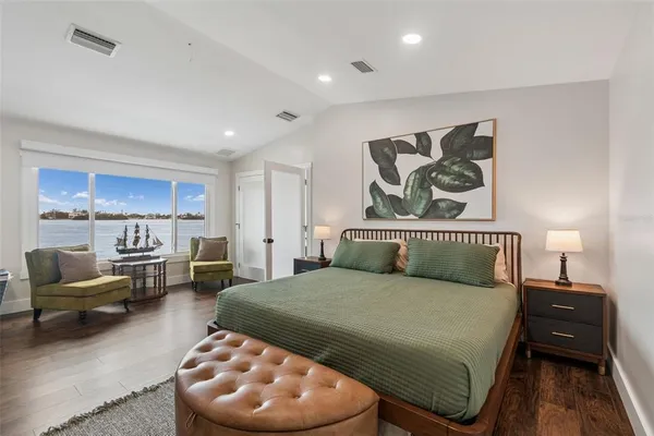 a bed room with a bed and a tv