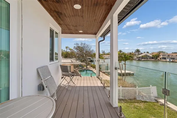 an aerial view of a houses with ocean view