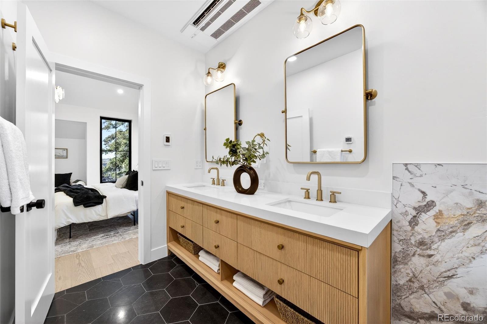 5175 Raleigh Street Denver, CO 80212 - Photo 22 of 49 a spacious en suite bathroom with double sink