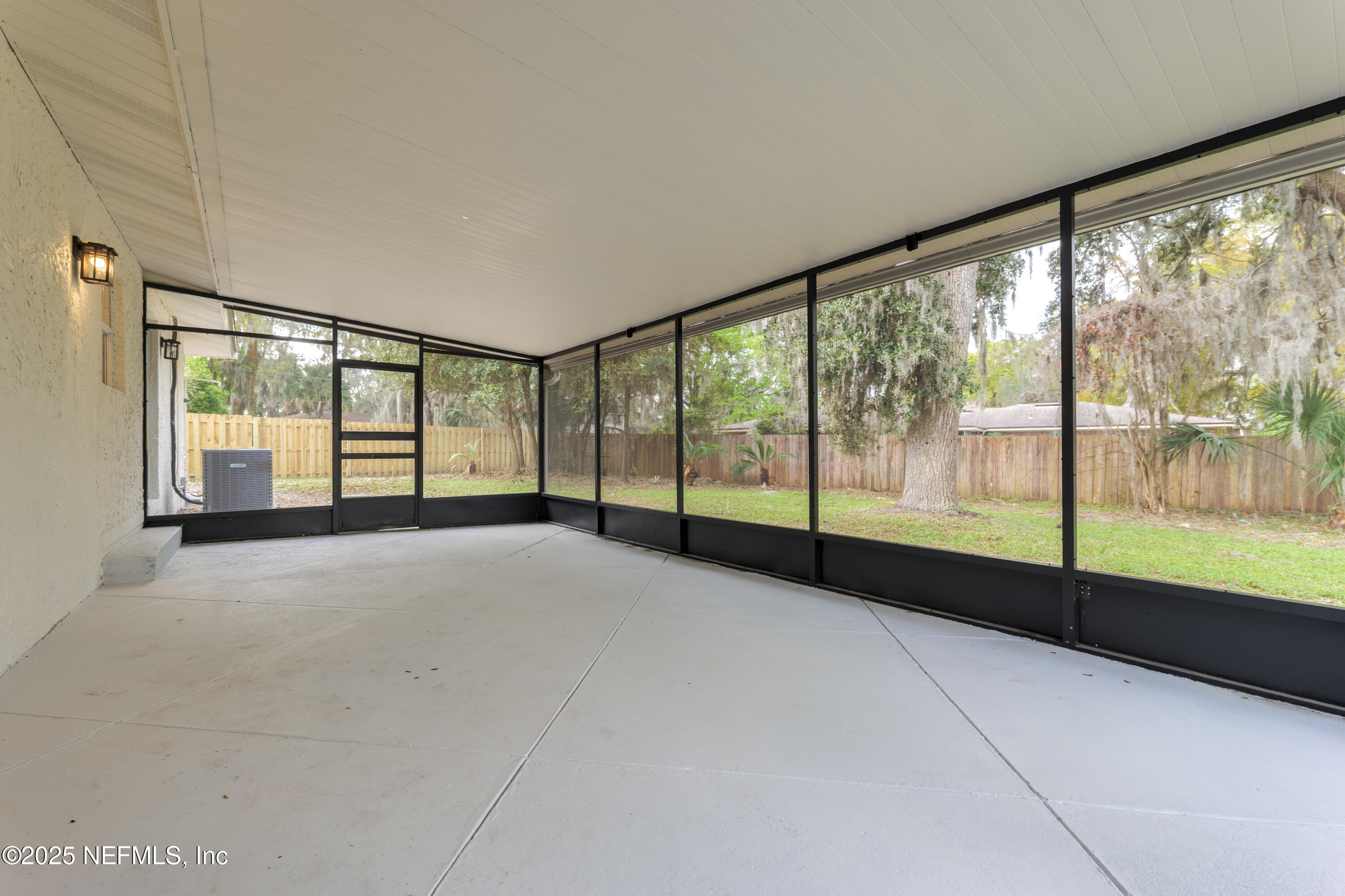 4146 Heath Road Jacksonville, FL 32277 - Photo 29 of 36 a view of an empty room with wooden floor and a window