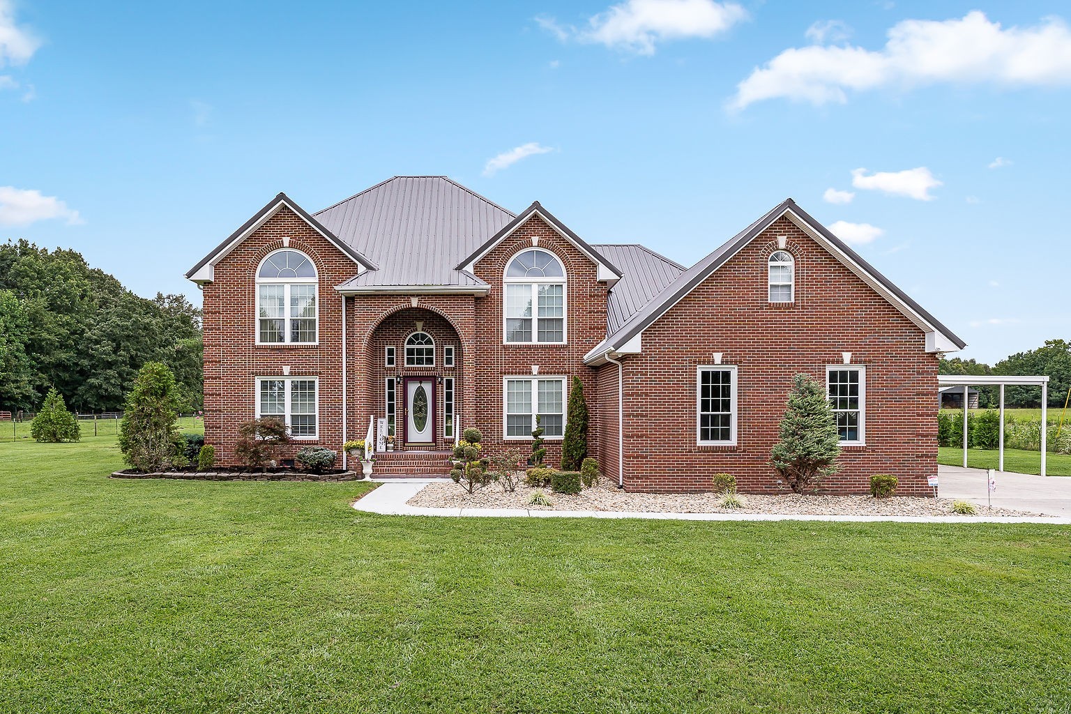 926 Ball Park Road Morrison, TN 37357 - Photo 1 of 69 a front view of a house with a garden and plants