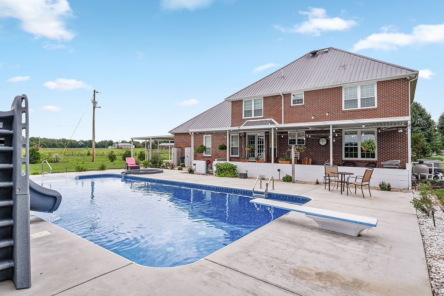 926 Ball Park Road Morrison, TN 37357 - Photo 48 of 69 a view of a house with sitting area and swimming pool