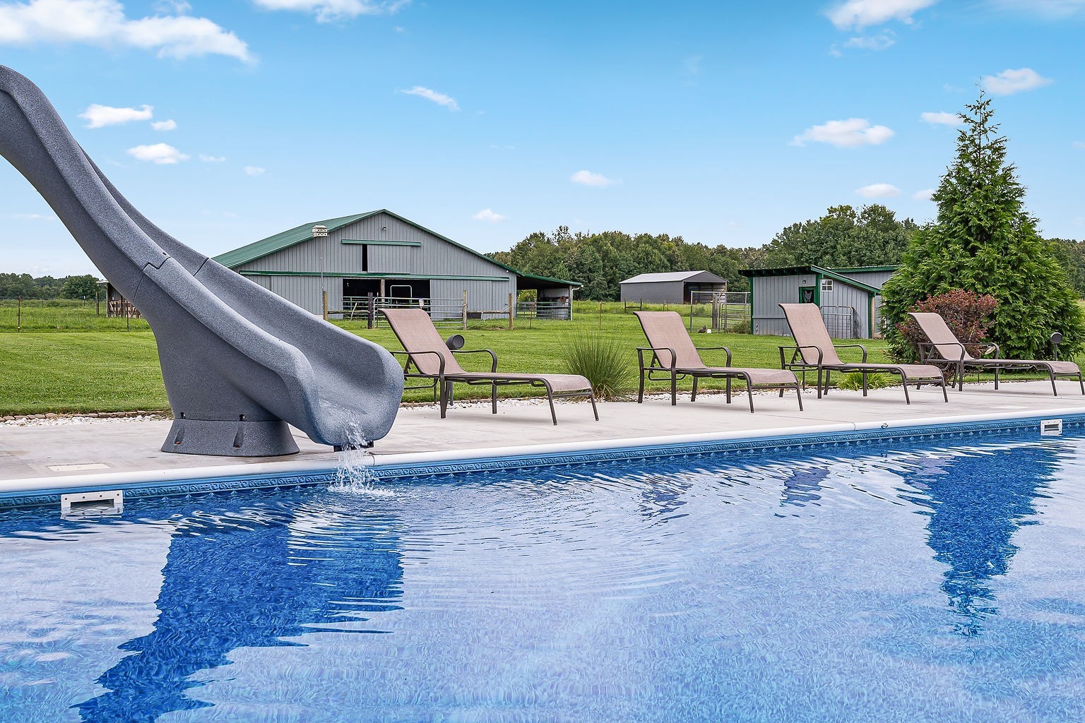 926 Ball Park Road Morrison, TN 37357 - Photo 54 of 69 a view of a swimming pool with an outdoor space and seating area