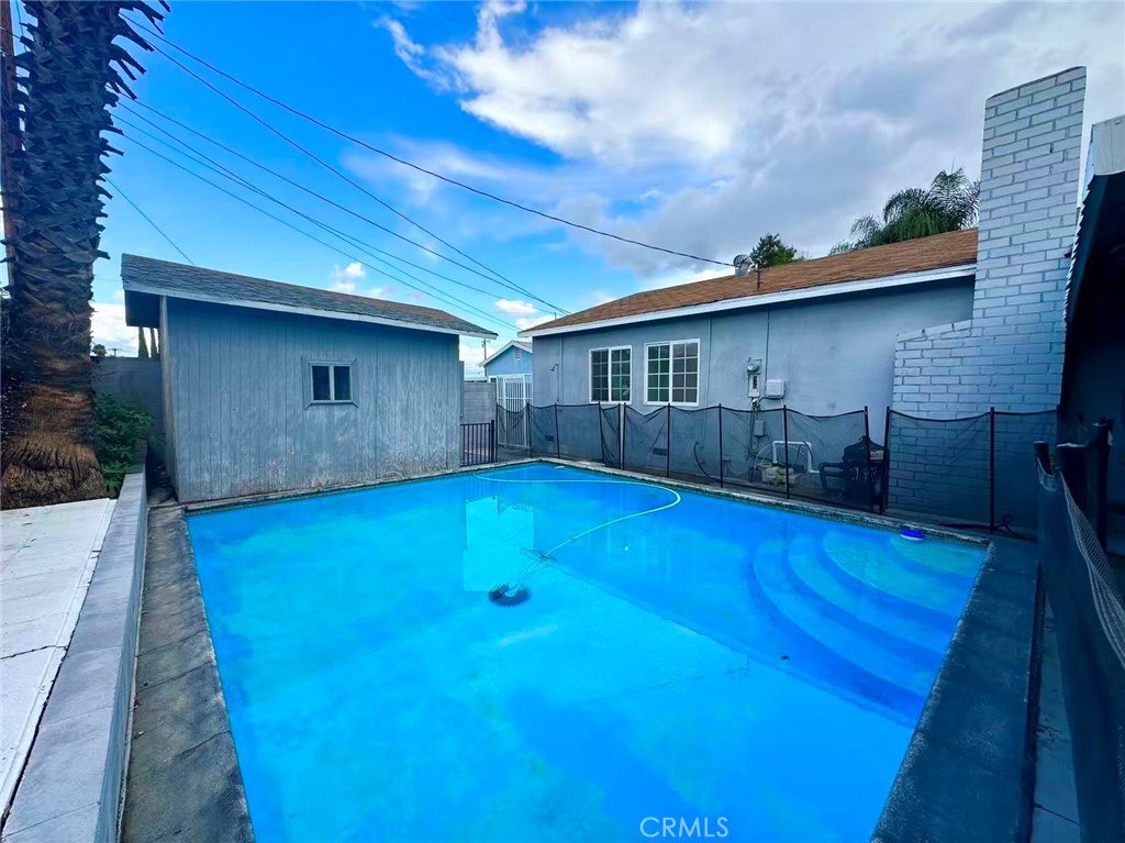 1143 South 9th Avenue Hacienda Heights, CA 91745 - Photo 13 of 15 a view of a house with a swimming pool