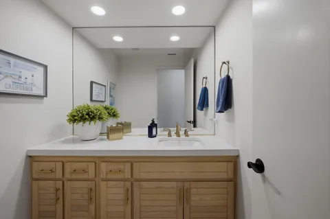 a bathroom with a sink and a mirror